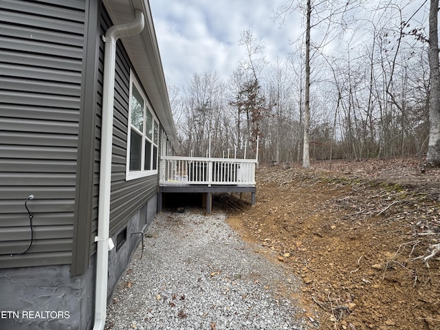 view of side of property with a deck