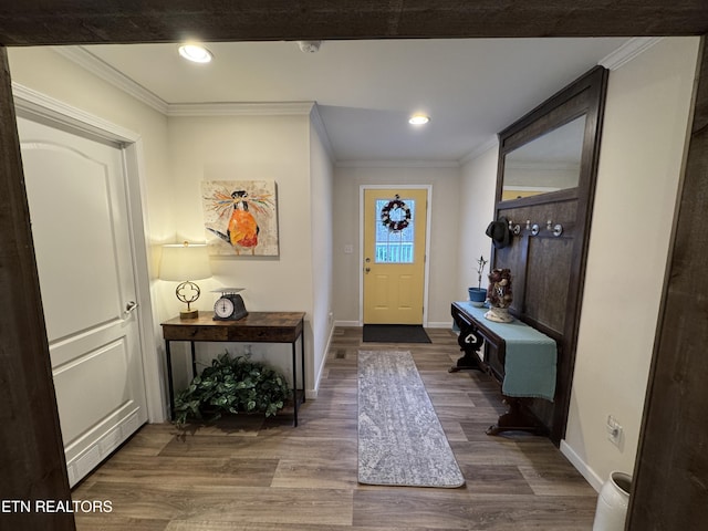 interior space with hardwood / wood-style flooring and crown molding