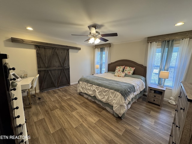 bedroom with ceiling fan, hardwood / wood-style floors, and crown molding