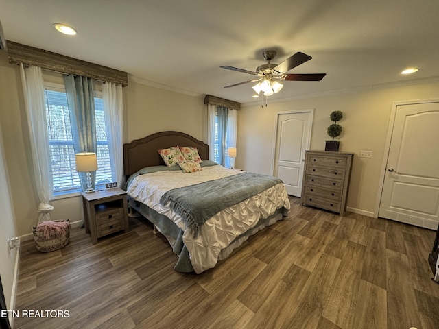 bedroom featuring dark hardwood / wood-style floors, ceiling fan, and crown molding