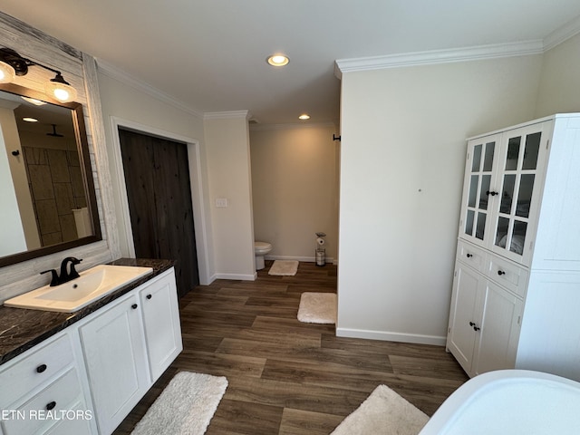 full bathroom with vanity, toilet, wood-type flooring, and crown molding