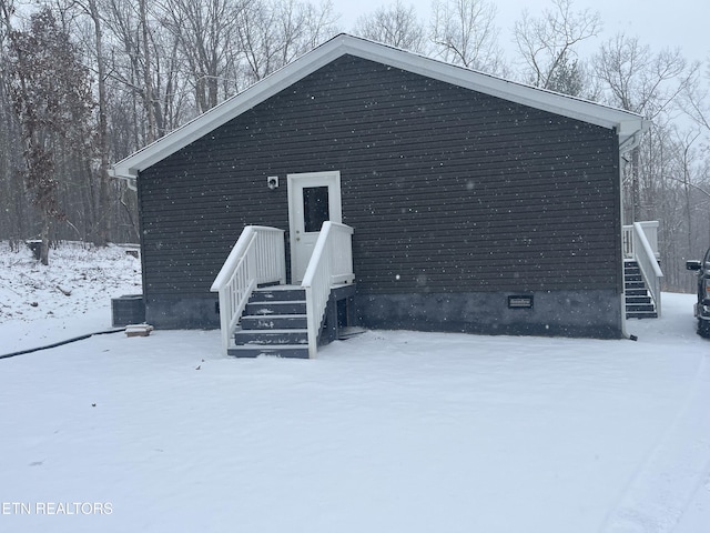 view of snow covered house