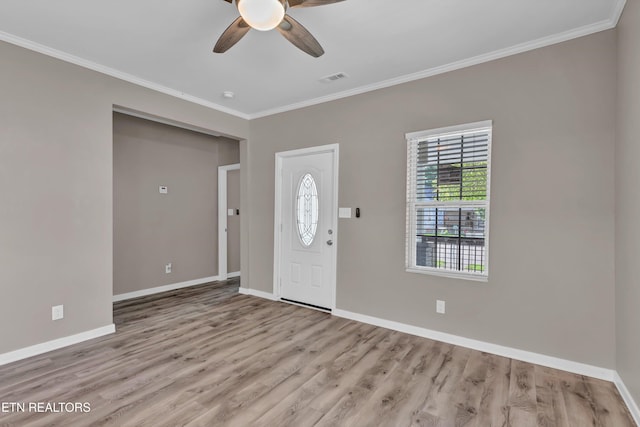 foyer with light hardwood / wood-style floors, ceiling fan, and crown molding