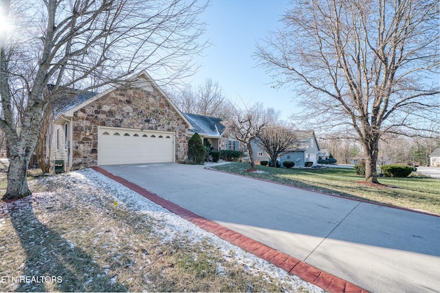 front of property featuring a front yard and a garage