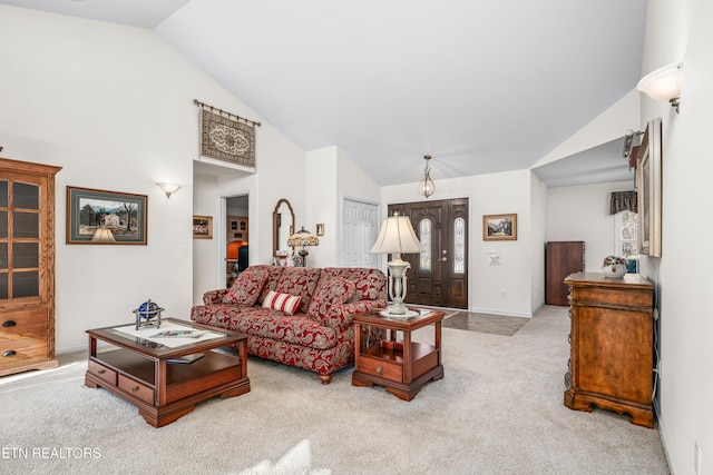 living room with light colored carpet and lofted ceiling