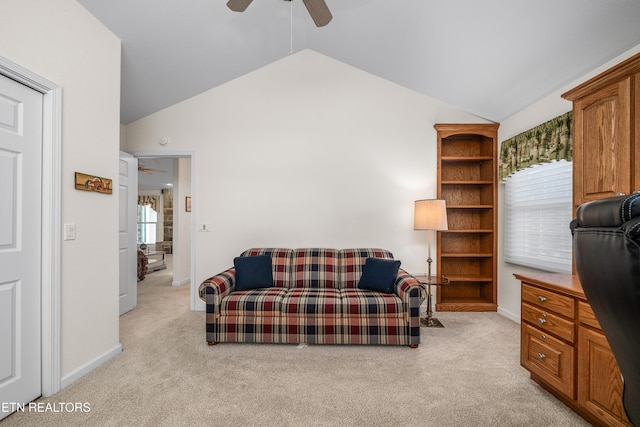 carpeted office with ceiling fan and vaulted ceiling