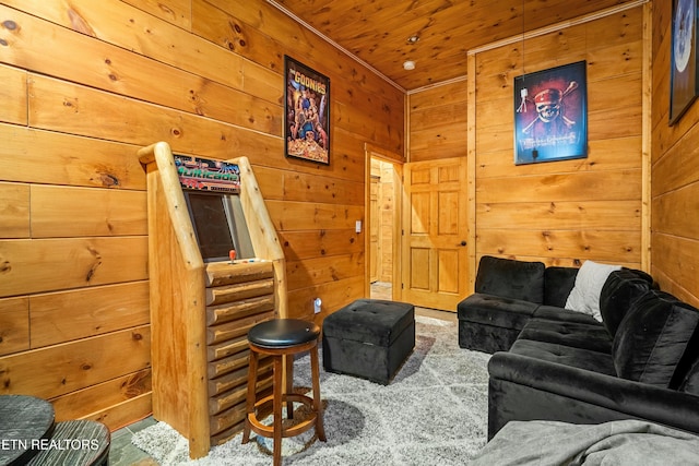 living room with carpet, wood walls, and wooden ceiling