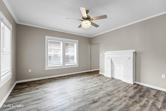 interior space with a fireplace, a healthy amount of sunlight, and hardwood / wood-style flooring