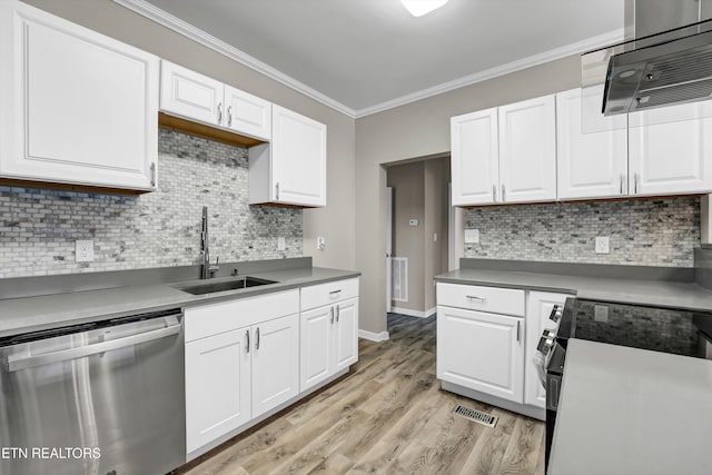 kitchen featuring dishwasher, stove, white cabinets, sink, and light hardwood / wood-style flooring