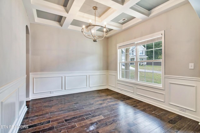 unfurnished dining area with a chandelier, beam ceiling, dark wood-type flooring, and coffered ceiling