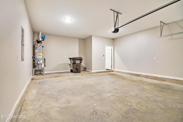 garage with a garage door opener and gas water heater