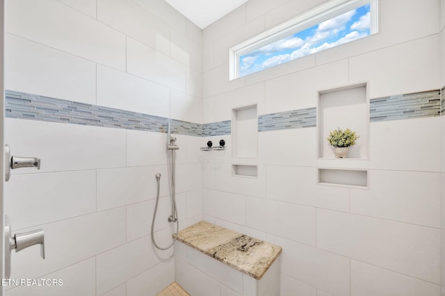 bathroom featuring tiled shower