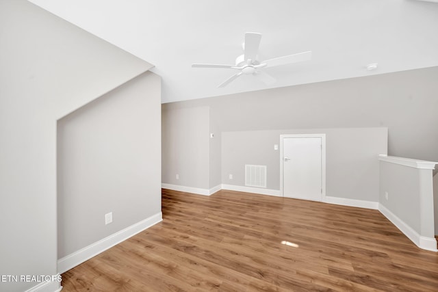 bonus room featuring hardwood / wood-style floors, ceiling fan, and lofted ceiling