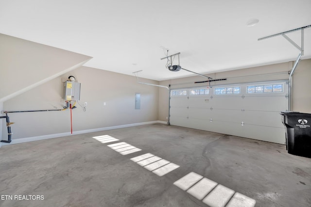 garage featuring tankless water heater, electric panel, and a garage door opener