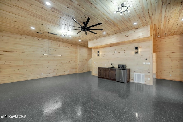 interior space featuring wooden walls, sink, and wood ceiling