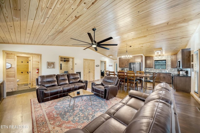 living room featuring ceiling fan with notable chandelier, light hardwood / wood-style flooring, lofted ceiling, and wood ceiling