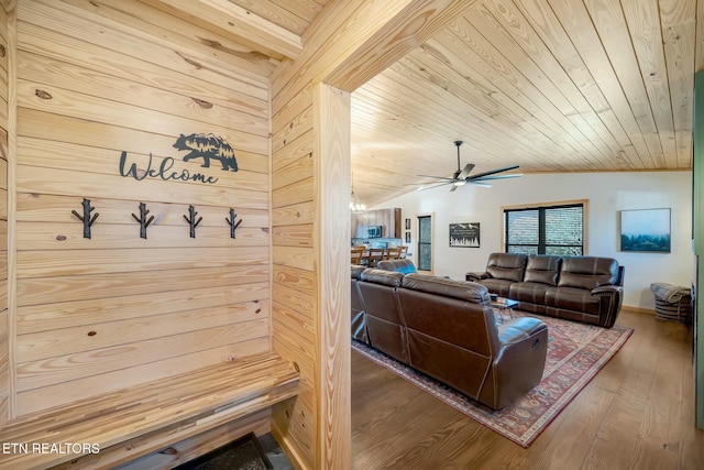 mudroom featuring ceiling fan, wooden ceiling, lofted ceiling, wooden walls, and hardwood / wood-style flooring