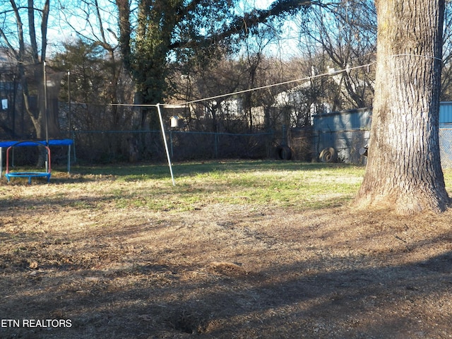 view of yard with a trampoline