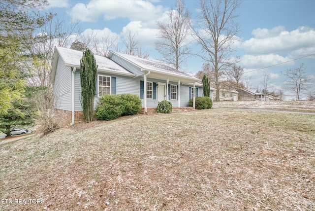 single story home with a porch