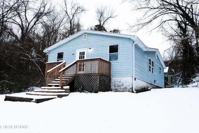 view of front facade with a wooden deck