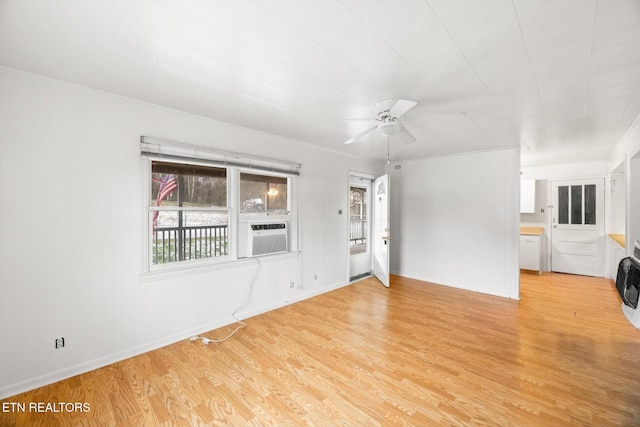 interior space featuring light hardwood / wood-style floors, ceiling fan, and cooling unit