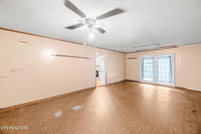 spare room featuring a textured ceiling and ceiling fan