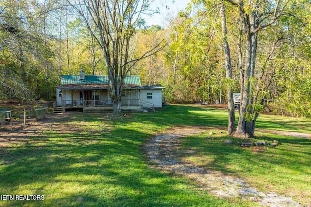 view of yard with covered porch