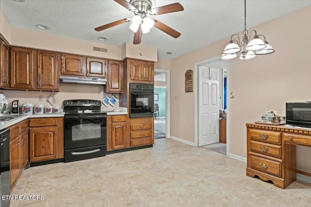 kitchen featuring ceiling fan with notable chandelier, hanging light fixtures, and black appliances