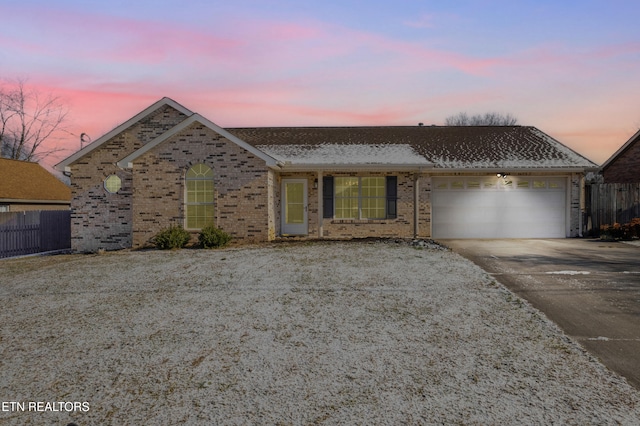 single story home with a garage