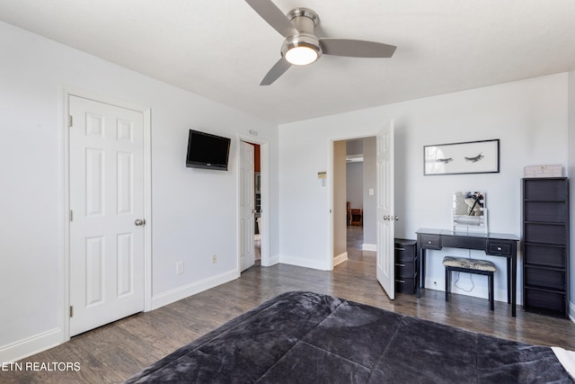 bedroom with ceiling fan and dark hardwood / wood-style floors