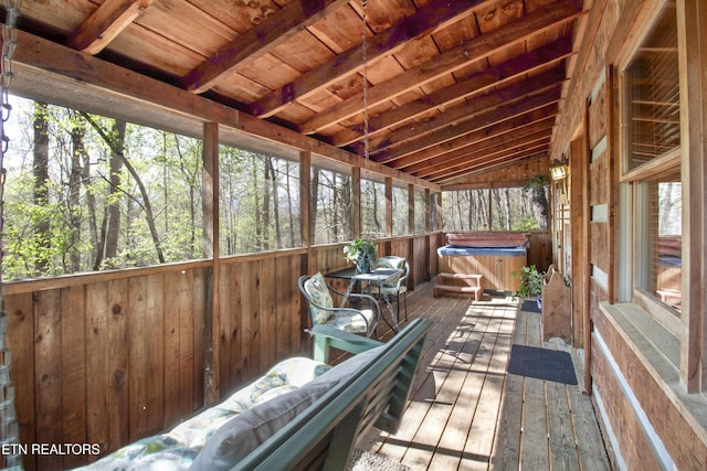 sunroom / solarium with vaulted ceiling with beams and wood ceiling