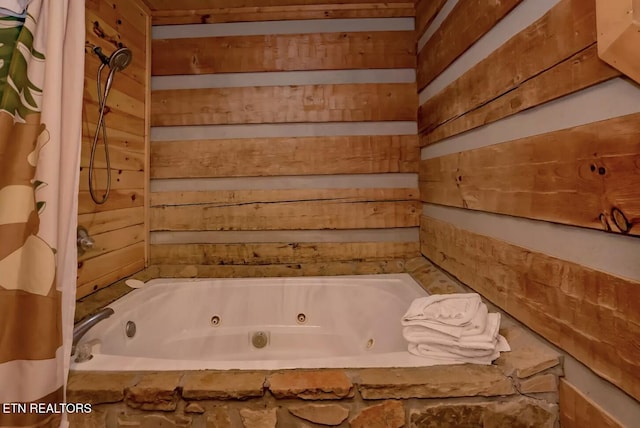 bathroom with wood walls