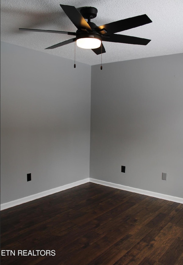 unfurnished room featuring ceiling fan, dark hardwood / wood-style flooring, and a textured ceiling