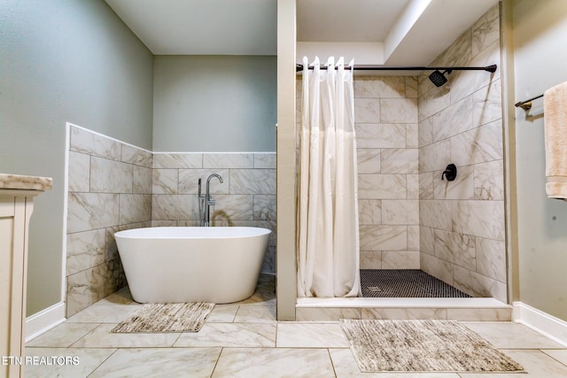 bathroom featuring tile walls and shower with separate bathtub