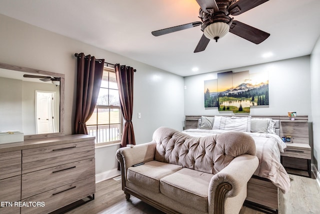 bedroom featuring ceiling fan and light hardwood / wood-style floors