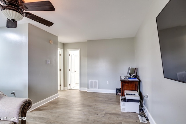 interior space featuring ceiling fan and light hardwood / wood-style floors