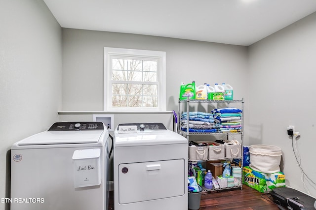 laundry room with separate washer and dryer and dark wood-type flooring