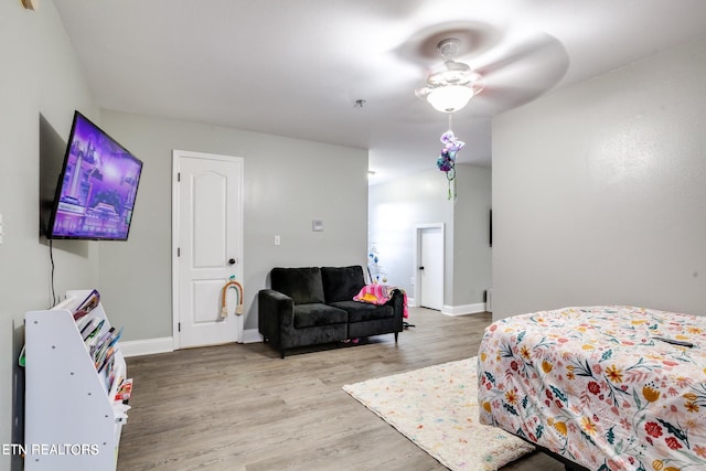 bedroom with ceiling fan and wood-type flooring