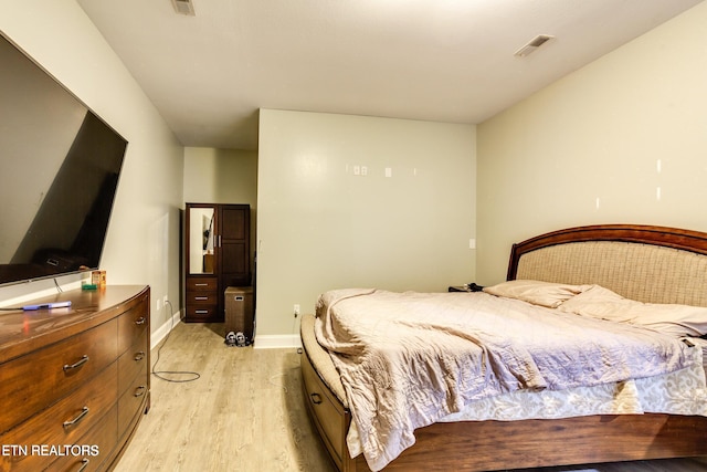 bedroom with light hardwood / wood-style flooring