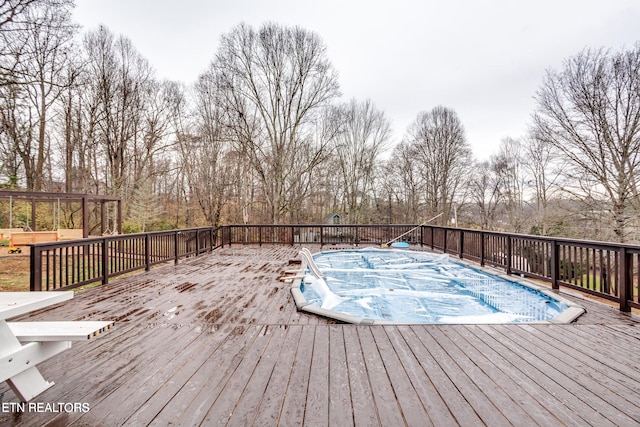 wooden terrace with a pergola