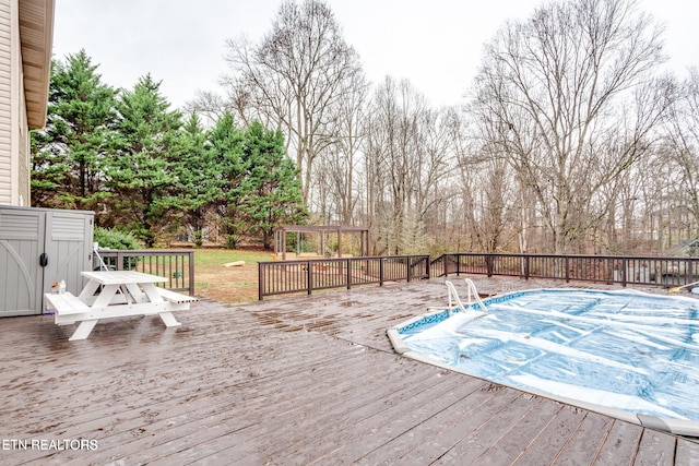 wooden deck with a covered pool