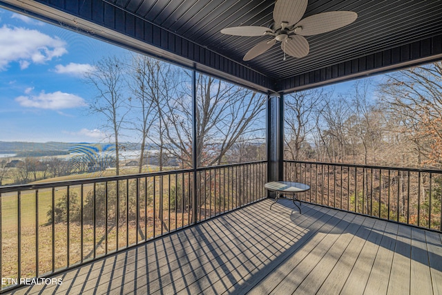 wooden deck featuring ceiling fan