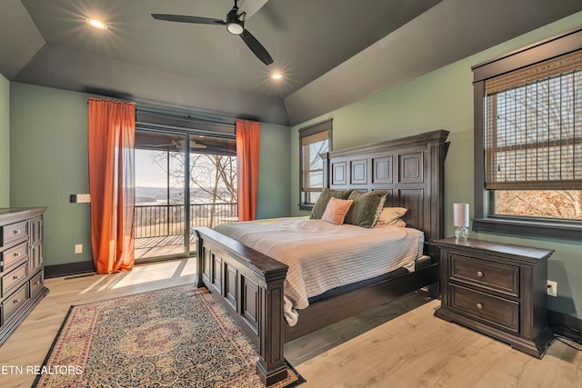 bedroom featuring multiple windows, access to outside, light hardwood / wood-style flooring, and ceiling fan