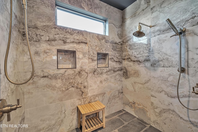 bathroom with a tile shower