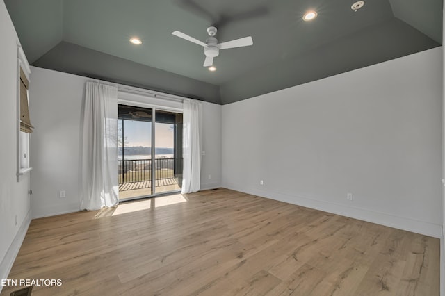 empty room featuring ceiling fan and light hardwood / wood-style floors