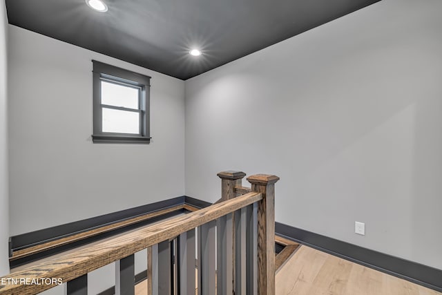 hall with light hardwood / wood-style floors