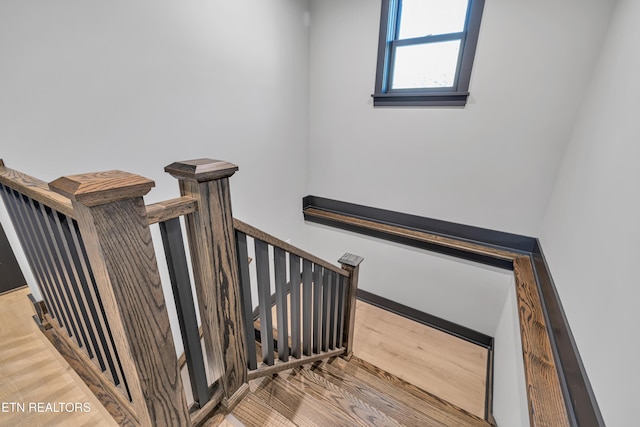 stairway featuring hardwood / wood-style floors