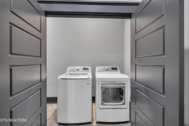 washroom with washer and clothes dryer