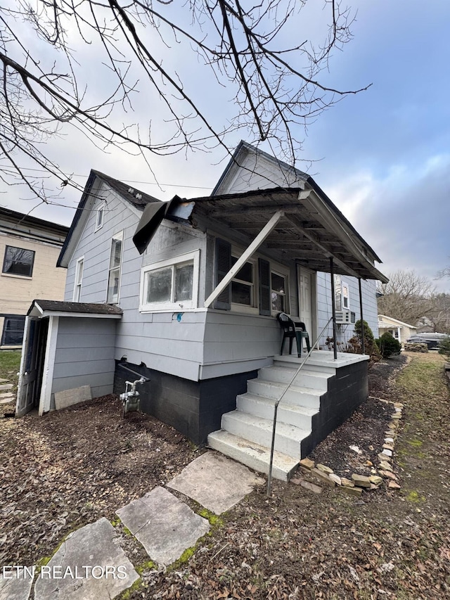 view of home's exterior featuring covered porch