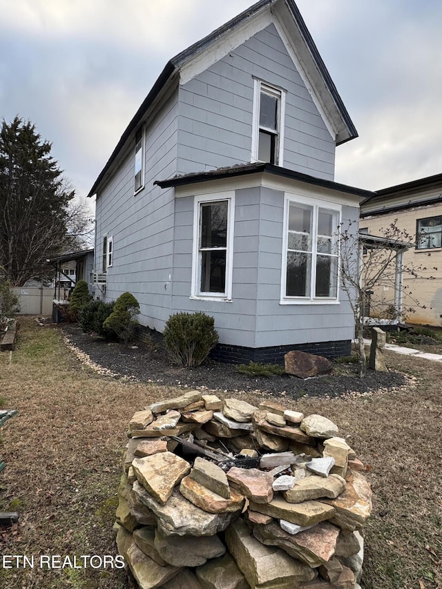 view of property exterior featuring a fire pit